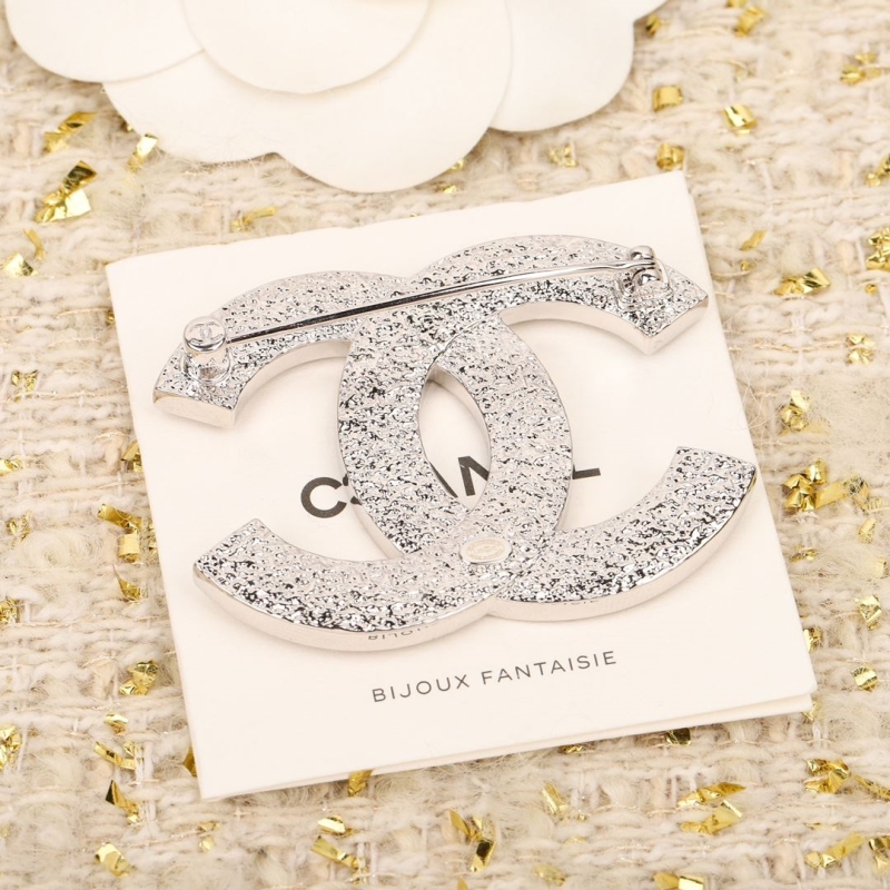 Ch**el brooches